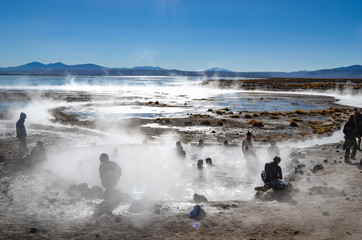 Uyuni, Bolivia - Sept 10, 2015: Tourists relaxing in the volcanic Aguas Calientes hot springs in...
