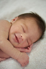 Happy smiling sleepy baby