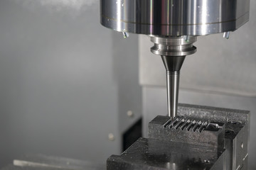 The CNC milling machine cutting the injection mild by solid ball end-mill tool.Hi-technology manufacturing process.