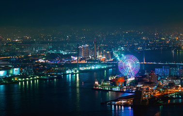 Aerial view of the Osaka Bay harbor area with the ferris wheel at night