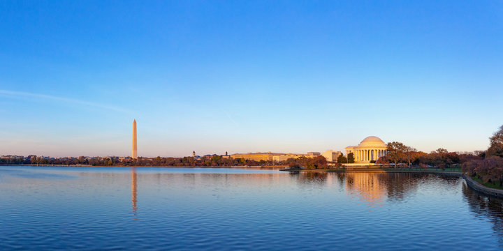 Jeffeerson Memorial and Washington Monument reflected on Tidal Basin in the evening, Washington DC, USA. Panoramic image