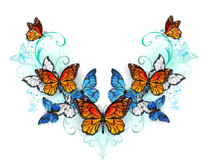 Obraz premium Symmetrical pattern of blue and orange butterflies