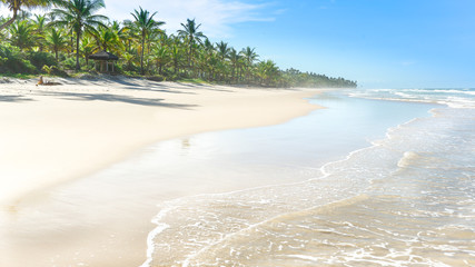 Water reflection on a large sand beach © SuperImages