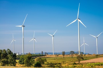 Wind turbines generating electricity with blue sky