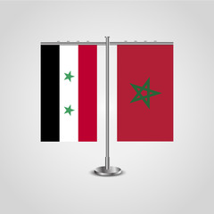 Table stand with flags of Syria and Morocco.Two flag. Flag pole. Symbolizing the cooperation between the two countries. Table flags