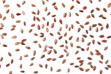 Brown flax seeds on white background - obrazy, fototapety, plakaty