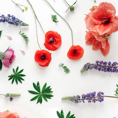 Floral pattern wildflowers poppy amaryllis peonies white background Flat lay top view Pattern flowers © kucherav