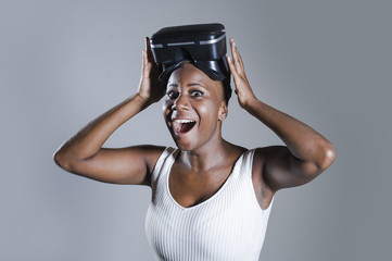happy black afro american woman showing VR 3d vision goggles aft