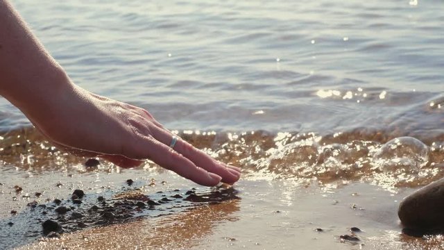 Woman touching water
