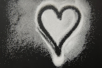 Spilled Sugar Heart Love Shape of Heart Black Background. unhealthy sugar. Love sugar Sweet.
