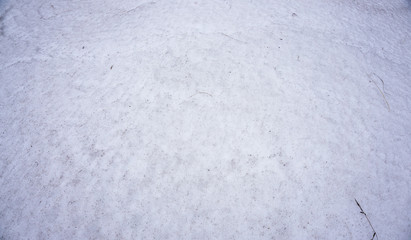 Surface of ground covered with snow in winter
