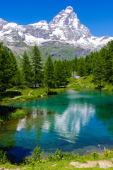 Beautiful landscape with the Matterhorn (Cervino) and another Matterhorn (Cervino) reflected on the Blue Lake (Lago Blu) near Breuil-Cervinia, Aosta, Italy
