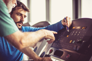 Checking speed on exercise machine.