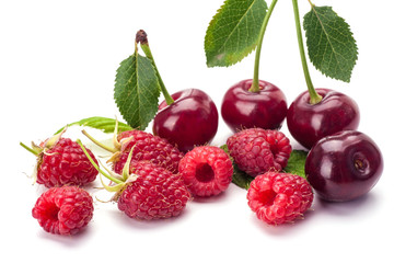 Cherry and raspberry isolated on white background. Vegetarian food.