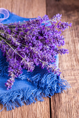Bunch of lavander on old wooden table.