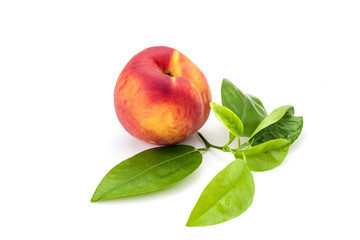 Peach with leaves isolated on white background