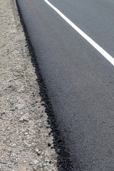 Obraz premium Asphalt Road Surface on Concrete Gravel.