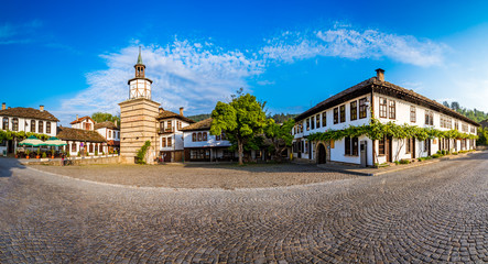 Fototapeta na wymiar Beautiful view of the Clock tower and the old town in the architectural traditional complex in Tryavna, Bulgaria