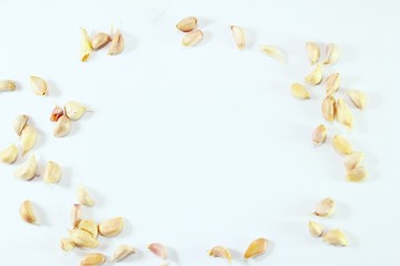 Small garlic scattered on a white background.