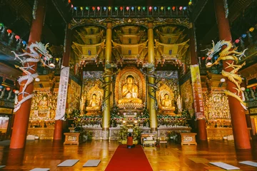 Stickers muraux Temple Golden Buddha statues inside Yakcheonsa Temple. Jeju, South Korea.