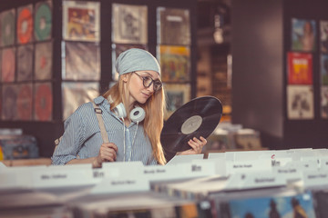 Young girl in a vinyl record store