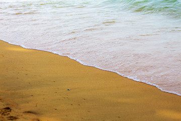 waves and sand on beach.