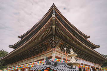 Fototapeta na wymiar Roof Detail at Yakcheonsa Temple. Jeju, South Korea.