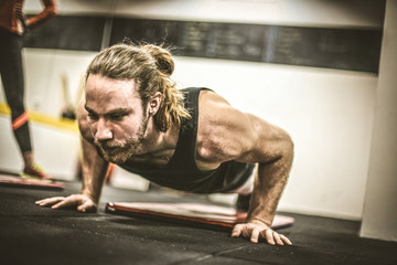 Young men exercise. Portrait.