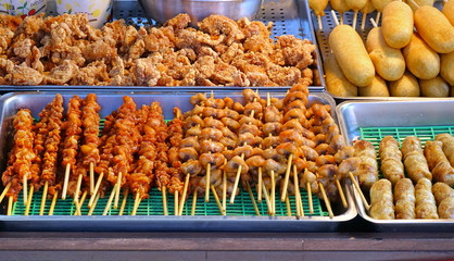 Food Stall Sells Skewers with Meat and Corn Dogs