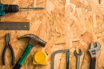 set of carpentry tools on wood background . flat lay tools working space for carpenter , top view.