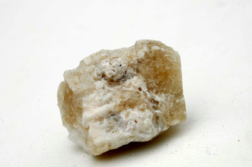 A piece of cryolite, a mineral with contents of aluminum and fluourine.