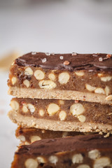 Stack of raw vegan chocolate candy snickers bars. Healthy lifestyle and raw vegan food concept.