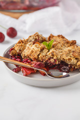 Summer berry crumble pie, light background, vegetarian breakfast. Healthy vegan food concept.