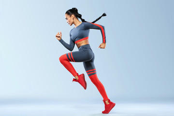 A strong athletic, women sprinter, running wearing in the sportswear, fitness and sport motivation....