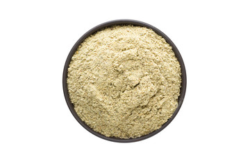 Blue Fenugreek Powder in clay bowl isolated on white background. Seasoning or spice top view