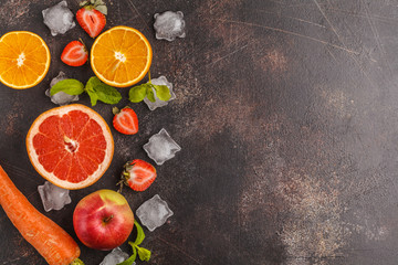 Ingredient for smoothies or juice: fruits, vegetables, berries. Top view, dark background.