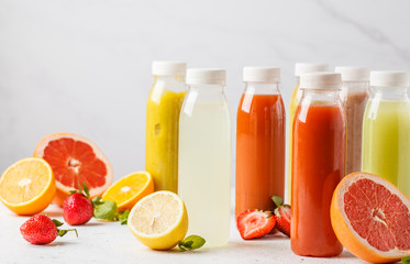 Variety colorful smoothie or juice bottles from berries, fruits and vegetables. Detox program, healthy lifestyle concept.