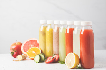 Variety colorful smoothie or juice bottles from berries, fruits and vegetables. Detox program, healthy lifestyle concept.