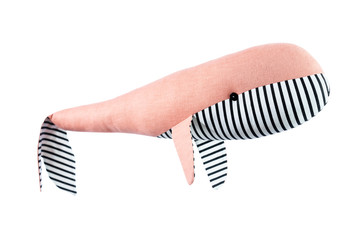 Closeup image of soft toy whale pillow with ornament isolated at white background.