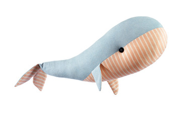 Closeup image of cute handmase toy whale pillow with ornament isolated at white background.