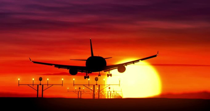 Jet airplane silhouette landing at the airport during sunset. Sun, shape of plane and flashing runway lights.