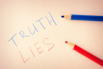 Words truth and lies, written in colored pencils on paper