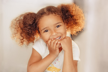 Portrait of a beautiful happy liitle girl close-up