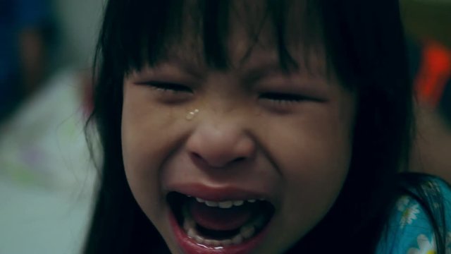 Little Asian girl crying and scream