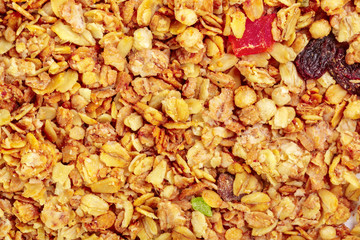 Homemade roasted granola on baking sheet breakfast food background