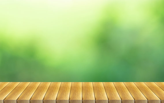reen nature blurred background and wooden floor
