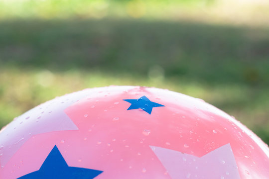 Wet Pink Ball And Abtract Background