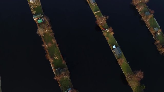 Aerial view of recreational harbour for small boats and bungalows on the lake at Loosdrecht Kalverstraat, The Netherlands.