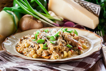 Risotto with champignon mushrooms, pork and parmesan