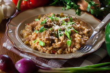 Risotto with champignon mushrooms, pork and parmesan